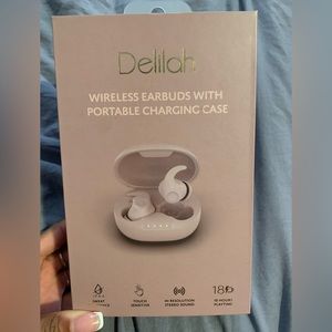 Delilah wireless earbuds with charging case. Can be paired with iPhone/android